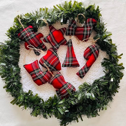 Christmas wreath with red plaid ornaments on a white background